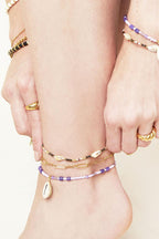 Enkelband – Eenvoudige ketting – Roestvrij staal - goud - gedragen om de enkel van een model