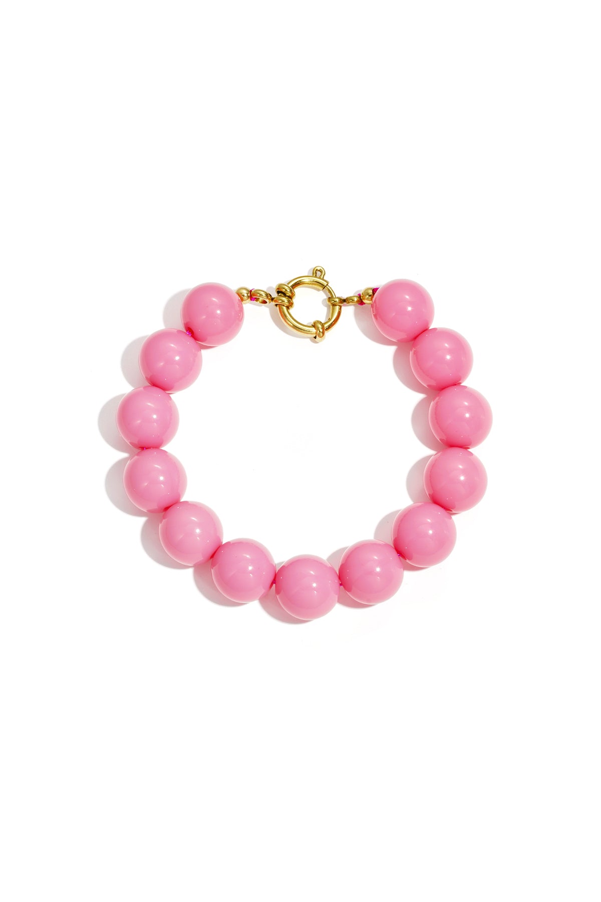 Armband met grote kralen en sluiting aan de voorkant - donker roze