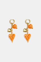 Oorbellen met hangende harten aan ketting