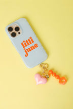 Tasbedels met hartje – Casual acryl – roze vast aan een telefoon