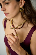 Gekoppelde ketting met gouden en gekleurde kralen